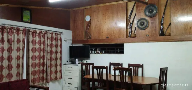 Dining area with a wooden table and chairs