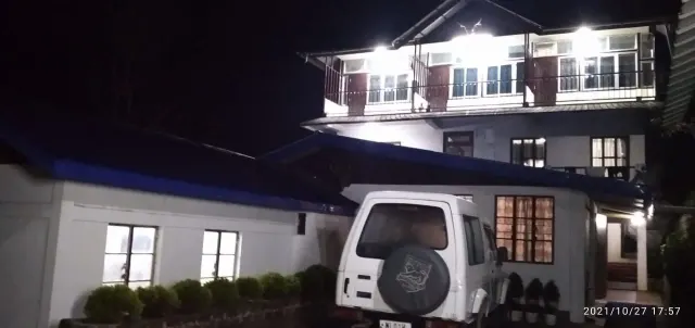 Uvie Homestay lit up at night